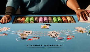 Baccarat squeeze mode showing dealer revealing cards slowly for dramatic effect.